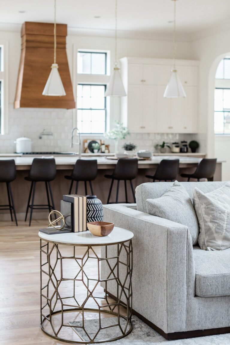 Gray-Sofa-And-Black-Counter-Stools-scaled